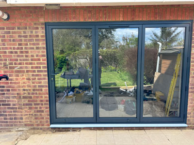 modern sliding glass doors with a dark frame