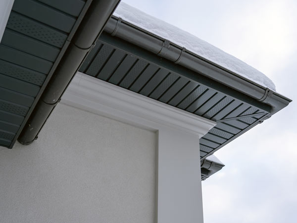 roofline detail showing dark gutters and white fascia