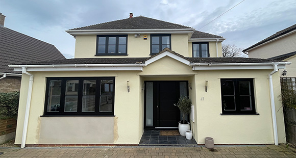 two story modern house with black windows